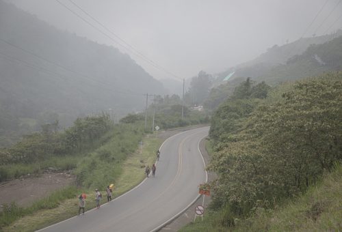 Venezuelan migrants walk up a highway in Norte de Santander, Colombia. They had been walking for 14 days by then.